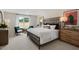 Spacious bedroom with decorative headboard, bedside tables, and window offering natural light at 93 Fair Child Rd, Spring Lake, NC 28390