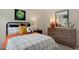 Bedroom with a comfy bed, rocket decor, and a view to the outside at 93 Fair Child Rd, Spring Lake, NC 28390