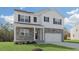 Beautiful home featuring stone accents, white siding, black shutters and a well-manicured front lawn at 93 Fair Child Rd, Spring Lake, NC 28390