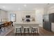 Modern eat-in kitchen featuring a center island, stainless steel appliances, and hardwood floors at 93 Fair Child Rd, Spring Lake, NC 28390