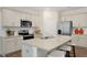 Well-lit kitchen showcasing granite countertops, stainless steel appliances, and ample cabinet space at 93 Fair Child Rd, Spring Lake, NC 28390