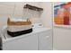 Modern laundry room featuring white appliances, ample storage, and stylish accents at 93 Fair Child Rd, Spring Lake, NC 28390