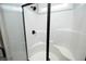 New shower with black trim and shower head; bright white shower stall with built-in seating at 97 Buckstone Pl, Willow Springs, NC 27592