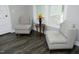 Cozy sitting area showcasing two chairs, wood-look floors, and neutral paint at 97 Buckstone Pl, Willow Springs, NC 27592