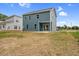 Exterior view of a two-story house with a patio and green backyard at O Shortline Rd, Roxboro, NC 27574