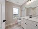 Bright bathroom showcasing a white vanity, modern fixtures, and a window offering natural light at O Shortline Rd, Roxboro, NC 27574