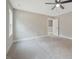Bedroom showcases neutral carpet, a ceiling fan, and a bright window at O Shortline Rd, Roxboro, NC 27574