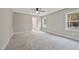 Spacious carpeted bedroom with a ceiling fan and a view to the bathroom at O Shortline Rd, Roxboro, NC 27574