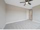 The carpeted bedroom boasts a ceiling fan and natural light and has easy access to the hallway at O Shortline Rd, Roxboro, NC 27574