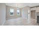 Bright dining room with light gray walls, modern floors, and contemporary chandelier at O Shortline Rd, Roxboro, NC 27574