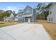 The home showcases a concrete driveway leading to the front entrance, surrounded by a well-maintained lawn at O Shortline Rd, Roxboro, NC 27574