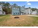 Beautiful two-story home featuring a blue exterior, pristine yard and concrete driveway at O Shortline Rd, Roxboro, NC 27574