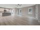 Spacious living room with modern flooring, large windows, and a view into the kitchen at O Shortline Rd, Roxboro, NC 27574