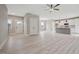 Open-concept living space boasts modern floors, white walls, and a stylish kitchen island at O Shortline Rd, Roxboro, NC 27574