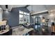 Inviting common room with cozy seating, large windows, stylish decor, and modern lighting features at 100 Cloud Berry Ln, Holly Springs, NC 27540