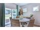 Cozy dining area with natural light and access to the backyard at 100 Cloud Berry Ln, Holly Springs, NC 27540