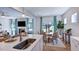Well-appointed kitchen with an island, seating, and an open layout to the dining and living spaces at 100 Cloud Berry Ln, Holly Springs, NC 27540
