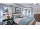 Inviting main bedroom features a ceiling fan and plenty of natural light from several windows at 100 Cloud Berry Ln, Holly Springs, NC 27540