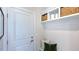 Mudroom with built-in shelving and seating at 100 Cloud Berry Ln, Holly Springs, NC 27540
