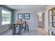 Home office with natural light, desk and chairs and an adjacent bathroom for added convenience at 100 Cloud Berry Ln, Holly Springs, NC 27540
