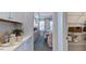 Kitchen pantry with custom cabinets and shelving provides ample storage space at 100 Cloud Berry Ln, Holly Springs, NC 27540
