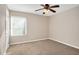 Inviting bedroom with a window, plush carpet, and a ceiling fan at 108 Ephesus Church Rd # 510, Chapel Hill, NC 27517