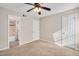 Bedroom with carpet floor, ceiling fan, and ensuite bathroom at 108 Ephesus Church Rd # 510, Chapel Hill, NC 27517