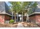 Two-story condo with brick accents, upper and lower balconies, and well-maintained landscaping at 108 Ephesus Church Rd # 510, Chapel Hill, NC 27517