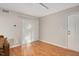 Living area showcases wood-look flooring, neutral walls, and a sliding glass door with vertical blinds at 108 Ephesus Church Rd # 510, Chapel Hill, NC 27517