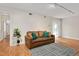 Bright and airy living room area with modern lighting, wood-look flooring, and a comfortable sofa at 108 Ephesus Church Rd # 510, Chapel Hill, NC 27517