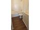 Full bathroom with tub, white vanity, and dark-toned flooring at 1409 Mcdearman Ave, Rocky Mount, NC 27804
