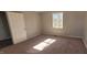 Bedroom featuring carpeted floors, neutral walls, and a closet for storage at 1409 Mcdearman Ave, Rocky Mount, NC 27804