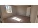 Comfortable bedroom features plush carpet, natural light, and a spacious closet at 1409 Mcdearman Ave, Rocky Mount, NC 27804