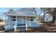 Charming single-story home with a cozy front porch and white railings at 1409 Mcdearman Ave, Rocky Mount, NC 27804