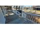 View of a covered front porch with white railing and wood decking at 1409 Mcdearman Ave, Rocky Mount, NC 27804