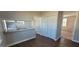 Kitchen with bar, plenty of cabinet space and view to carpeted bedroom at 1409 Mcdearman Ave, Rocky Mount, NC 27804