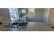 The kitchen boasts double windows and a clean white range at 1409 Mcdearman Ave, Rocky Mount, NC 27804