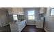 Efficient kitchen with white cabinetry, laminate countertops, and standard appliances at 1409 Mcdearman Ave, Rocky Mount, NC 27804