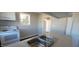 The kitchen has a new white range and convenient access to other parts of the house at 1409 Mcdearman Ave, Rocky Mount, NC 27804