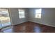 Cozy living room featuring hardwood floors, neutral walls, and a bright view at 1409 Mcdearman Ave, Rocky Mount, NC 27804