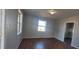 Living room with laminate floors and a view of the front yard at 1409 Mcdearman Ave, Rocky Mount, NC 27804