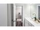 Bright bathroom featuring a white vanity and view into a bedroom at 1702 Red Roses Ave, Durham, NC 27703