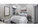 Comfortable bedroom with a neutral color scheme, a large window, and stylish decor at 1702 Red Roses Ave, Durham, NC 27703