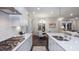 Bright kitchen featuring quartz countertops, gas range, stainless steel sink, and open layout into dining area at 1702 Red Roses Ave, Durham, NC 27703