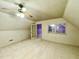 Bright attic space with neutral carpet, white beadboard ceiling, and ample natural light at 1809 Waddill Way, Henderson, NC 27536