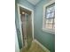 Bathroom includes a glass shower door, tile flooring, and a window at 1809 Waddill Way, Henderson, NC 27536