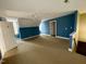 Large bedroom with neutral carpeting and a ceiling fan at 1809 Waddill Way, Henderson, NC 27536