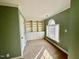 Bedroom with built-in shelving and arched window that provides natural light at 1809 Waddill Way, Henderson, NC 27536