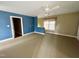 Spacious bedroom featuring neutral carpeting and a cozy reading nook at 1809 Waddill Way, Henderson, NC 27536