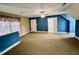Large bedroom featuring neutral carpeting and multiple entrances at 1809 Waddill Way, Henderson, NC 27536